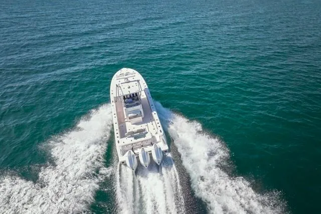 Slide: The Image of Bluewater 35 boat cruising on open sea, 2022 model, aerial view. - 69