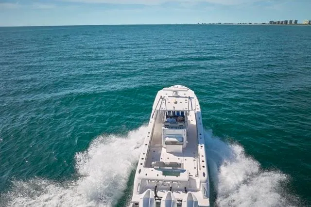 Slide: The Image of 2022 Bluewater 35 boat cruising on open ocean waters. - 72