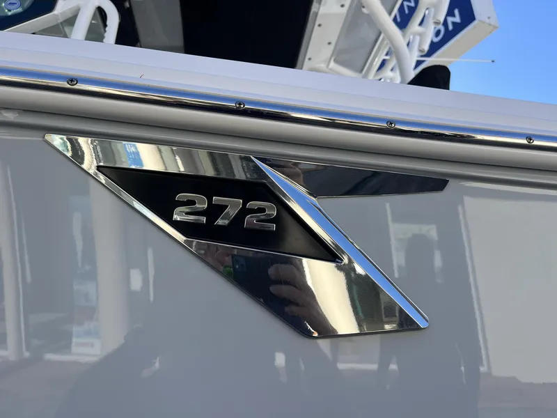 Slide: The Image of Close-up of 2023 Blackfin 272 boat emblem with chrome detailing. - 11