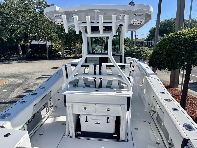 Slide: The Image of 2023 Blackfin 272 boat interior with helm, seating, and storage compartments. - 12