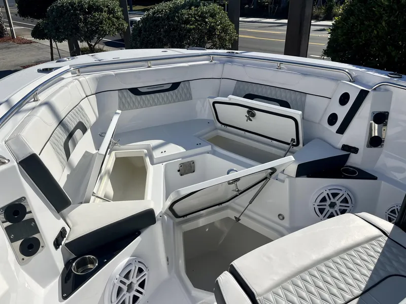 Slide: The Image of 2023 Blackfin 272 boat interior with open storage compartments and seating. - 18