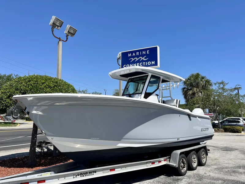 Slide: The Image of 2023 Blackfin 272 boat on trailer at Marine Connection dealership. - 2