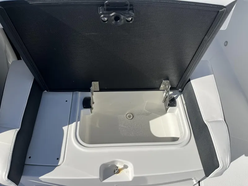 Slide: The Image of Open storage compartment on 2023 Blackfin 272 boat, featuring sleek design and durable materials. - 20