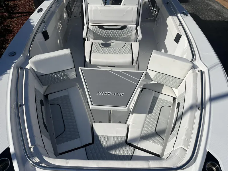 Slide: The Image of Luxurious seating area on 2023 Blackfin 272 boat with elegant white upholstery. - 22