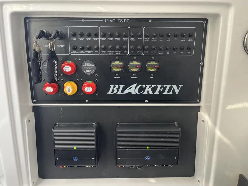 Slide: The Image of Control panel of 2023 Blackfin 272 boat with switches and keys. - 25