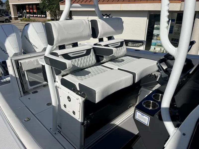 Slide: The Image of 2023 Blackfin 272 boat interior with dual Mercury engines and luxurious seating. - 27