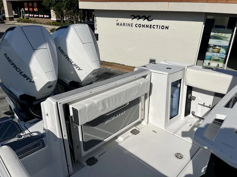 Slide: The Image of 2023 Blackfin 272 boat with dual Mercury engines at Marine Connection dealership. - 28