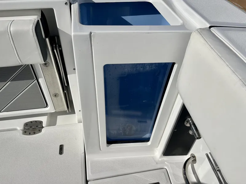 Slide: The Image of 2023 Blackfin 272 boat interior with seating and storage compartments. - 29