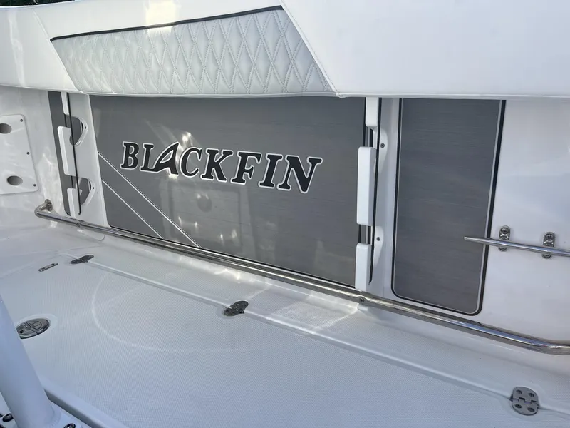 Slide: The Image of 2023 Blackfin 272 boat interior with logo and sleek design elements. - 32