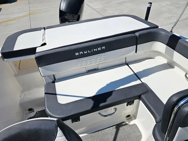 Slide: The Image of 2021 Bayliner VR5 Bowrider OB boat seating area with sleek design and comfortable cushions. - 12