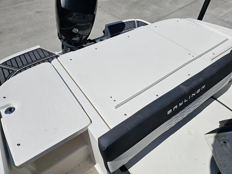 Slide: The Image of 2021 Bayliner VR5 Bowrider OB boat deck with outboard motor, featuring sleek design. - 14