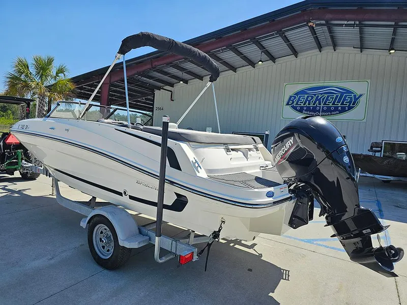 Slide: The Image of 2021 Bayliner VR5 Bowrider OB on trailer, parked outside Berkeley Outdoors dealership. - 2