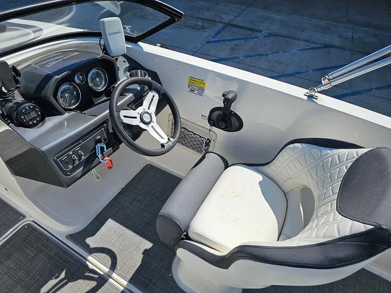 Slide: The Image of 2021 Bayliner VR5 Bowrider OB cockpit with steering wheel and comfortable seating. - 21