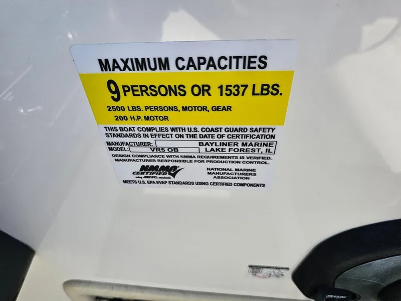 Slide: The Image of 2021 Bayliner VR5 Bowrider OB capacity label: 9 persons or 1537 lbs, 200 HP motor. - 23