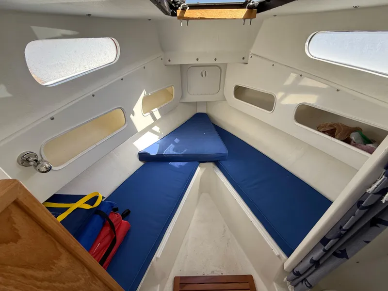 Slide: The Image of 2018 Rosborough 246 YARMOUTH boat interior with blue cushions and wooden accents. - 13