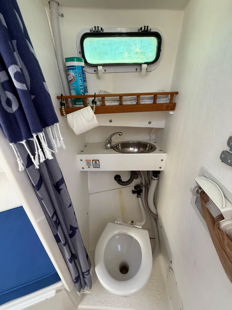 Slide: The Image of Compact bathroom in 2018 Rosborough 246 Yarmouth boat with sink, toilet, and window. - 16
