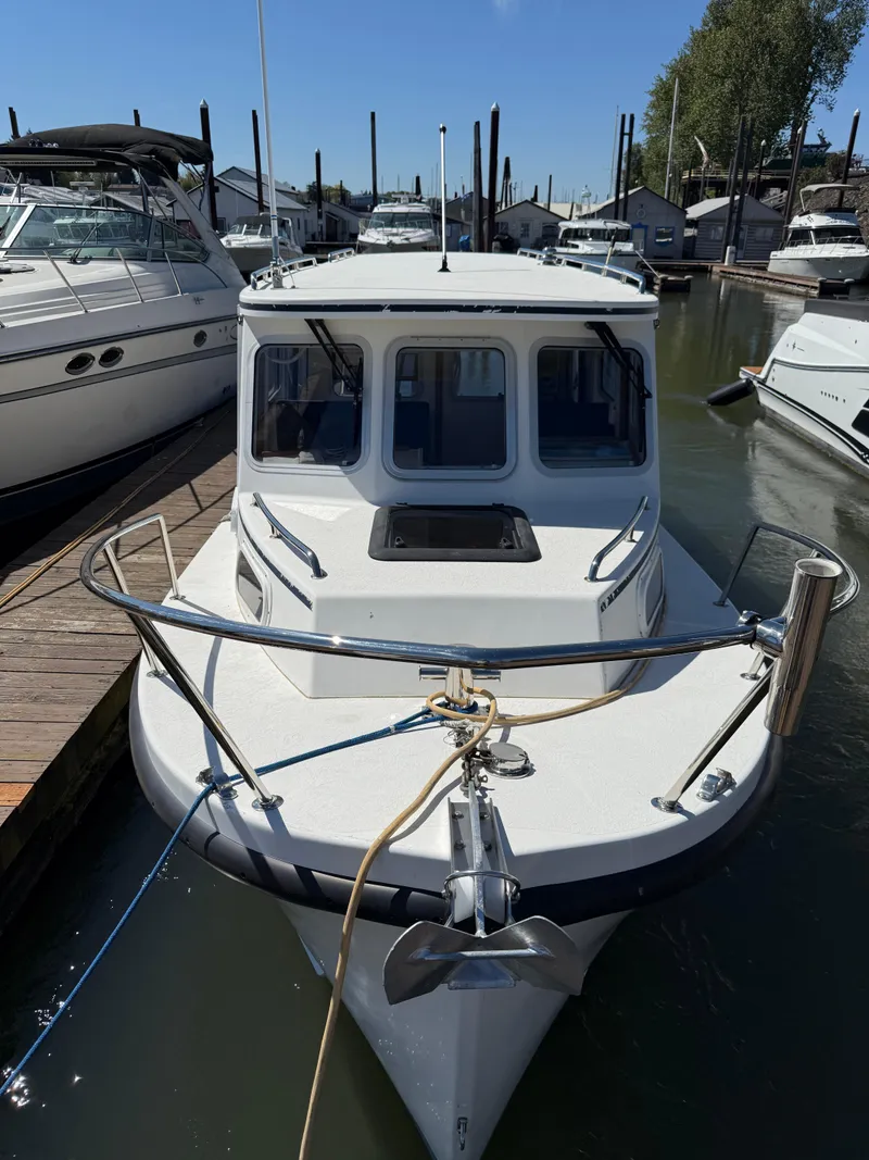Slide: The Image of 2018 Rosborough 246 Yarmouth boat docked at marina, front view. - 2
