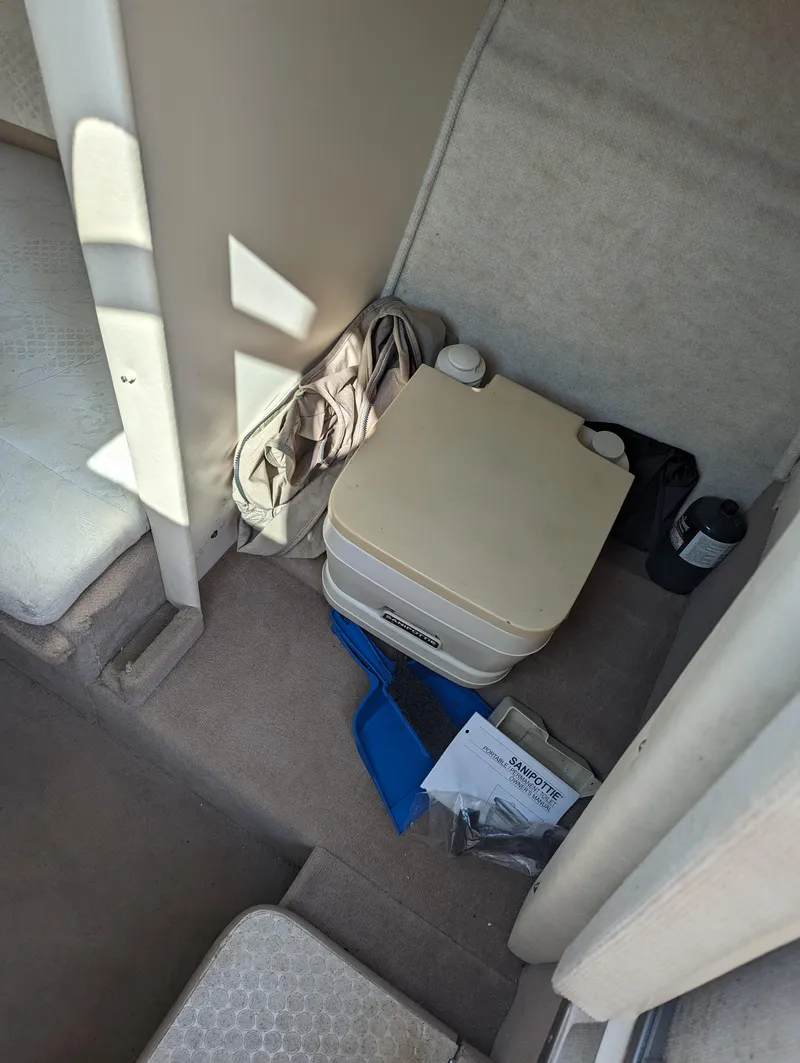 Slide: The Image of Interior of 2001 Sea Ray 225 Weekender with portable toilet and accessories. - 14