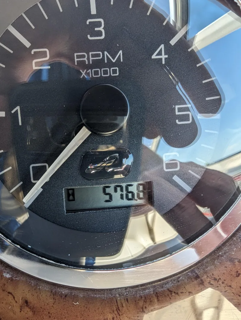 Slide: The Image of Close-up of a 2001 Sea Ray 225 Weekender tachometer showing 576.8 hours. - 15