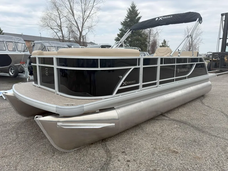 The Image of 2025 Godfrey EX2086SFLX pontoon boat with canopy, parked on asphalt, showcasing sleek design. - 0