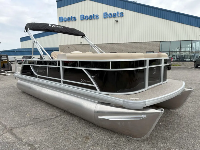 Slide: The Image of 2025 Godfrey EX2086SFLX pontoon boat parked outside a dealership. - 3