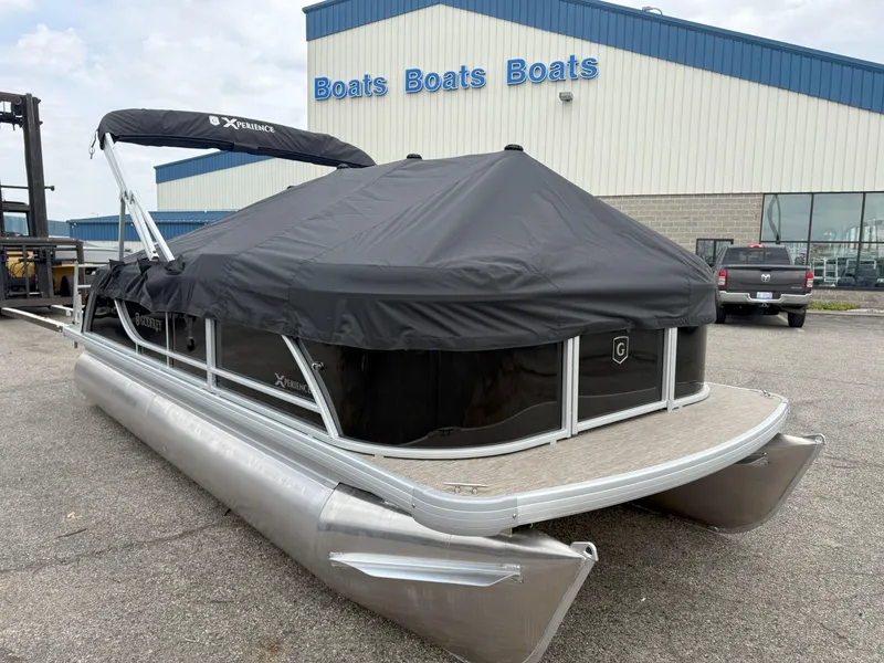 Slide: The Image of 2025 Godfrey EX2086SFLX pontoon boat with cover at dealership. - 4