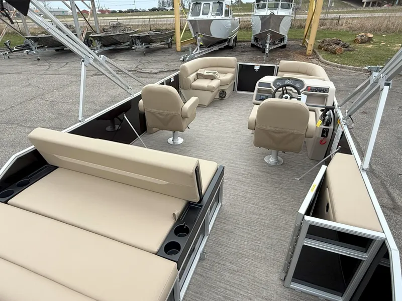 Slide: The Image of 2025 Godfrey EX2086SFLX pontoon boat with beige seating and modern helm. - 8