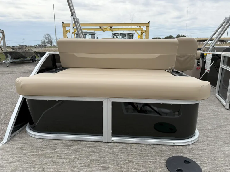 Slide: The Image of 2025 Godfrey EX2086SFLX pontoon boat with beige seating and sleek black exterior. - 9