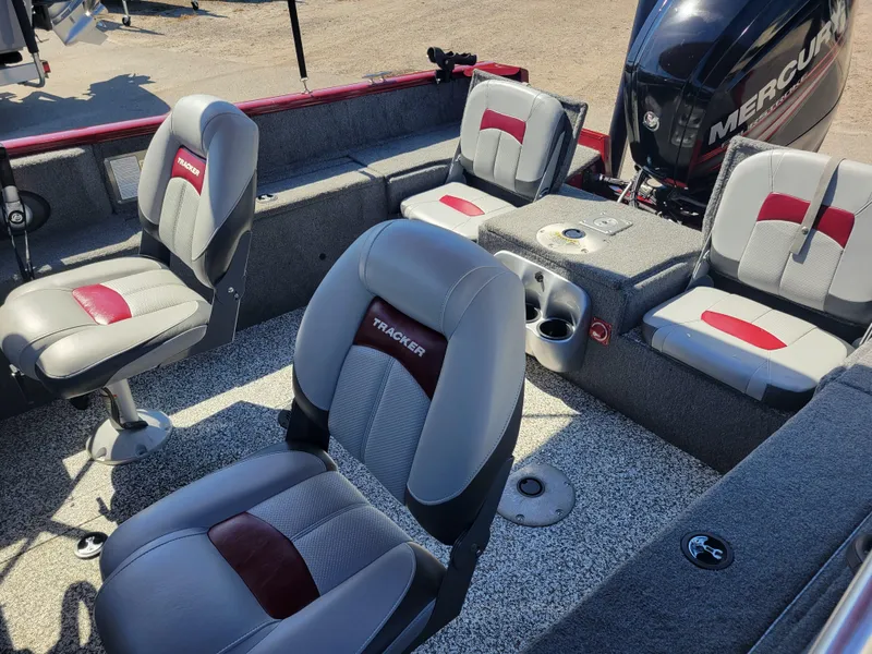 Slide: The Image of 2016 Tracker Pro Guide V-175 Combo boat interior with seating and Mercury engine. - 10