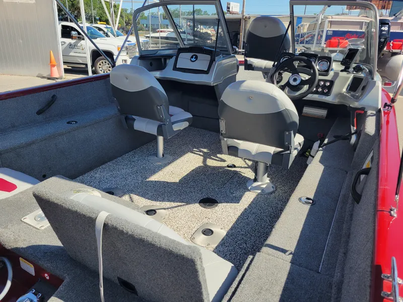 Slide: The Image of 2016 Tracker Pro Guide V-175 Combo boat interior with seating and dashboard. - 14