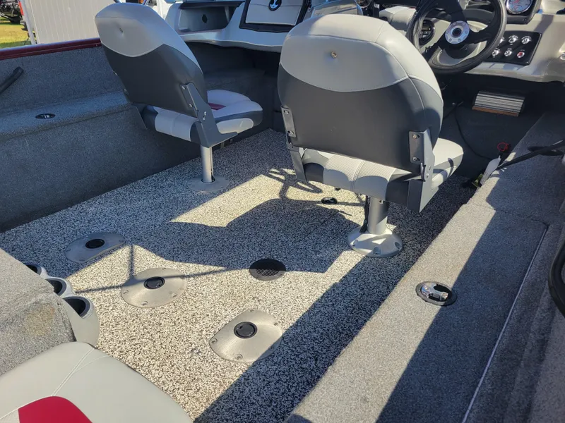 Slide: The Image of 2016 Tracker Pro Guide V-175 Combo interior with seating and control panel. - 15