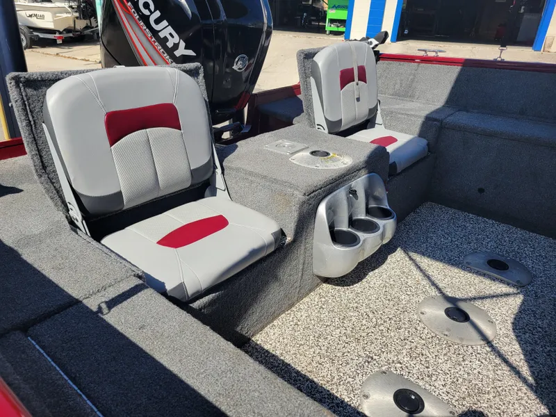 Slide: The Image of 2016 Tracker Pro Guide V-175 Combo boat interior with seating and cup holders. - 18