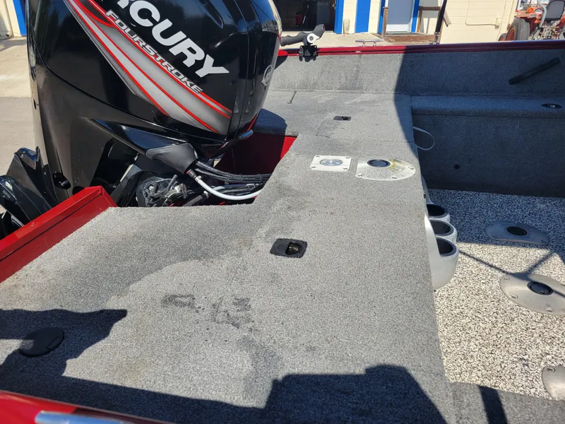 Slide: The Image of 2016 Tracker Pro Guide V-175 Combo boat interior with Mercury engine, featuring spacious deck layout. - 19