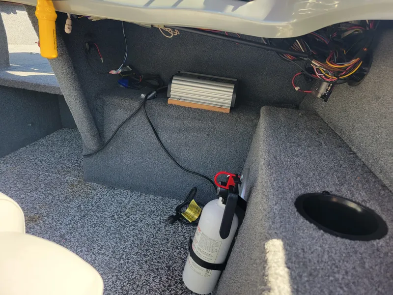 Slide: The Image of Interior of 2016 Tracker Pro Guide V-175 Combo boat with wiring and fire extinguisher. - 20