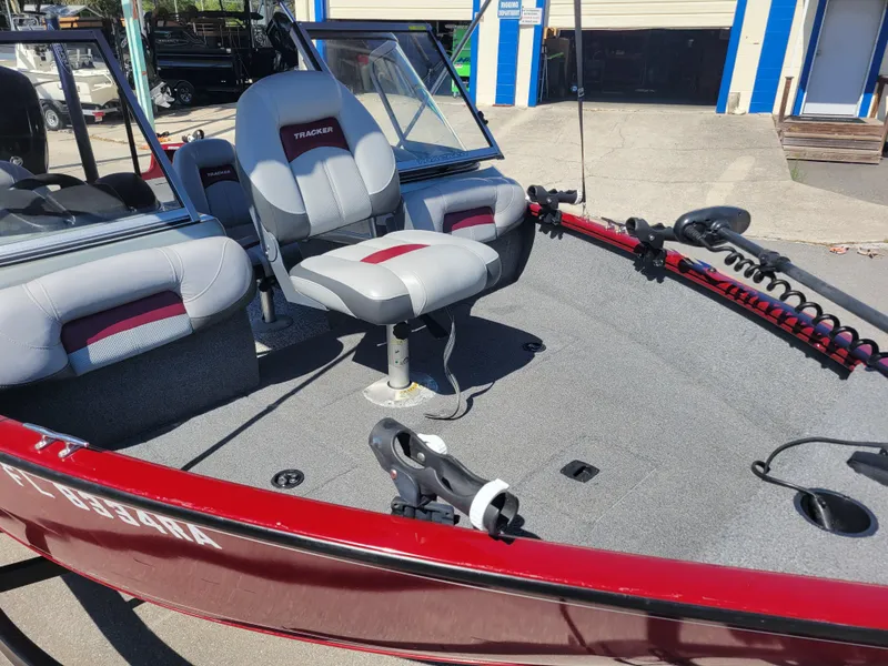 Slide: The Image of 2016 Tracker Pro Guide V-175 Combo boat with seating and fishing rod holders. - 22