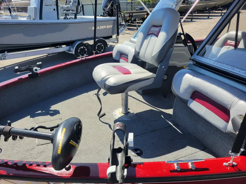 Slide: The Image of 2016 Tracker Pro Guide V-175 Combo boat interior with seating and trolling motor. - 9