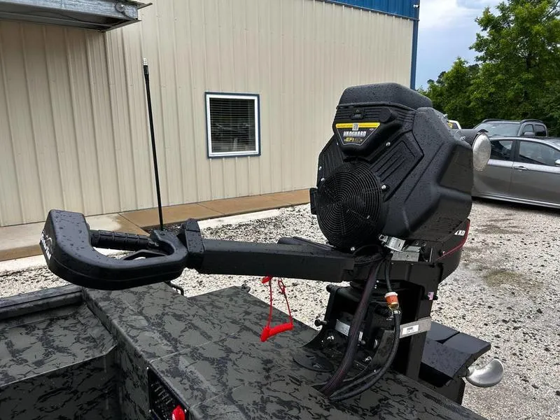 Slide: The Image of 2025 Gator Tail 1860 Extreme Mod V boat motor in a parking lot. - 13