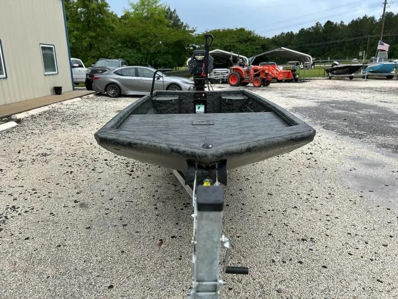 Slide: The Image of 2025 Gator Tail 1860 Extreme Mod V boat on trailer in outdoor setting. - 3