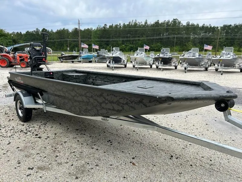 Slide: The Image of 2025 Gator Tail 1860 Extreme Mod V boat on trailer, displayed outdoors. - 4