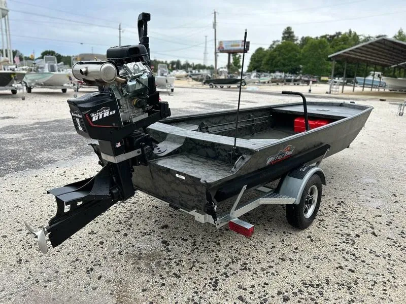 Slide: The Image of 2025 Gator Tail 1860 Extreme Mod V boat on trailer, parked outdoors. - 5
