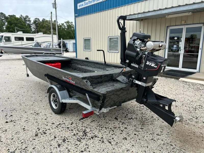 Slide: The Image of 2025 Gator Tail 1860 Extreme Mod V boat on trailer outside a building. - 6