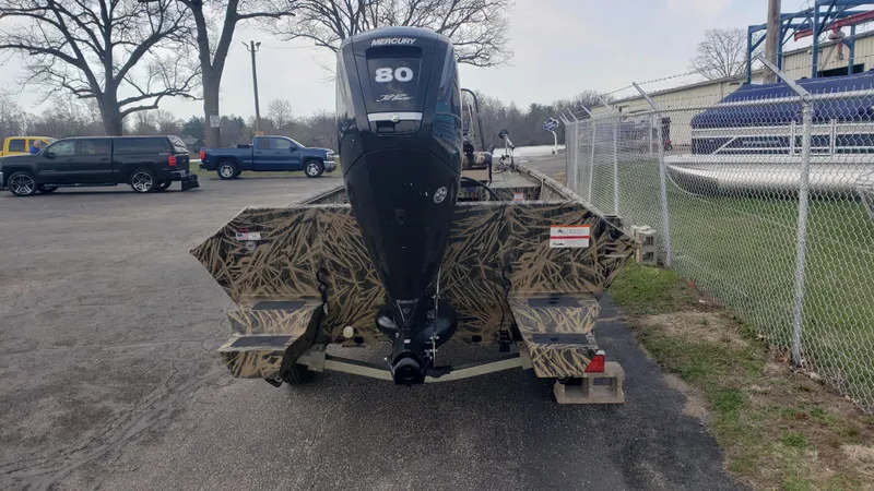 Slide: The Image of 2021 Lowe RTX1760PT boat with camouflage design and 80 HP Mercury engine. - 3