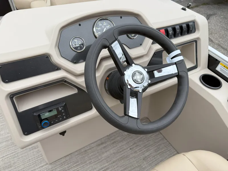Slide: The Image of Steering console of 2025 Godfrey EX2086CX boat with modern controls and gauges. - 10