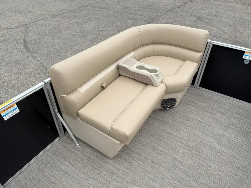 Slide: The Image of Luxurious seating on 2025 Godfrey EX2086CX pontoon boat with beige upholstery and cup holders. - 13