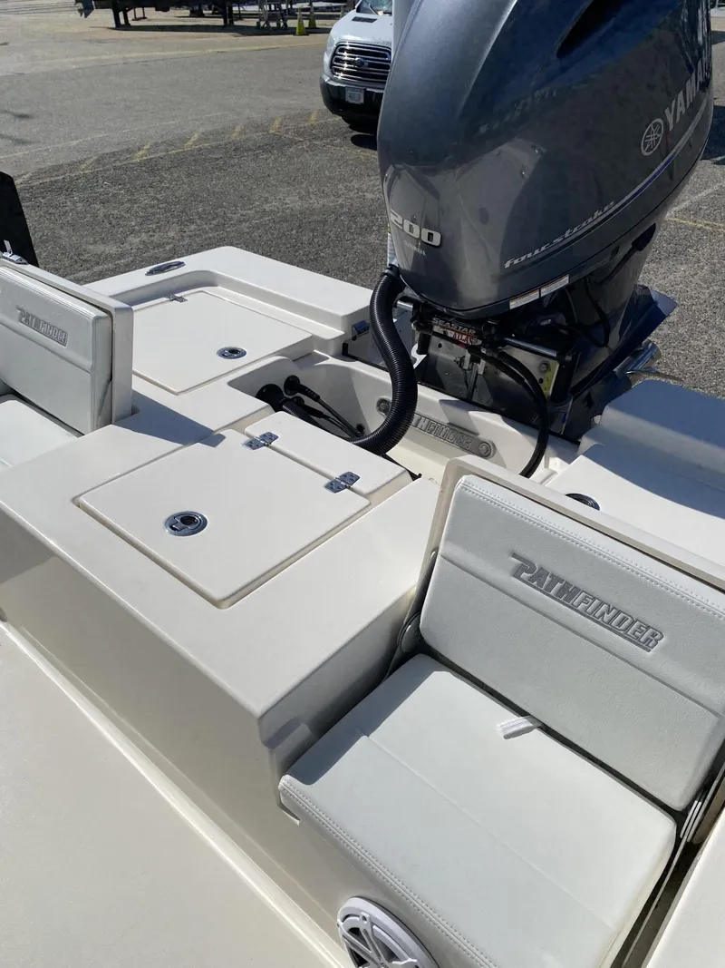 Slide: The Image of 2021 Pathfinder 2200 TRS boat with Yamaha engine, featuring seating and storage compartments. - 6