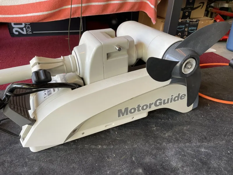 Slide: The Image of MotorGuide trolling motor on a 2021 Pathfinder 2200 TRS boat, garage setting. - 8