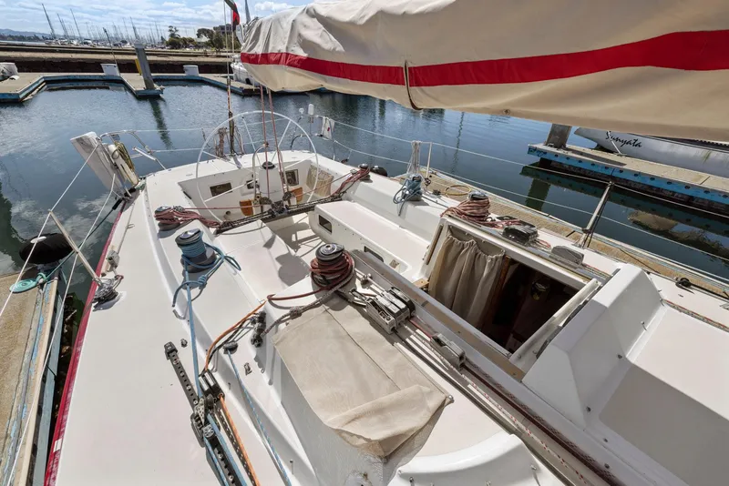 Slide: The Image of 1994 J Boats J/130 sailboat docked, showcasing deck and cockpit area. - 17