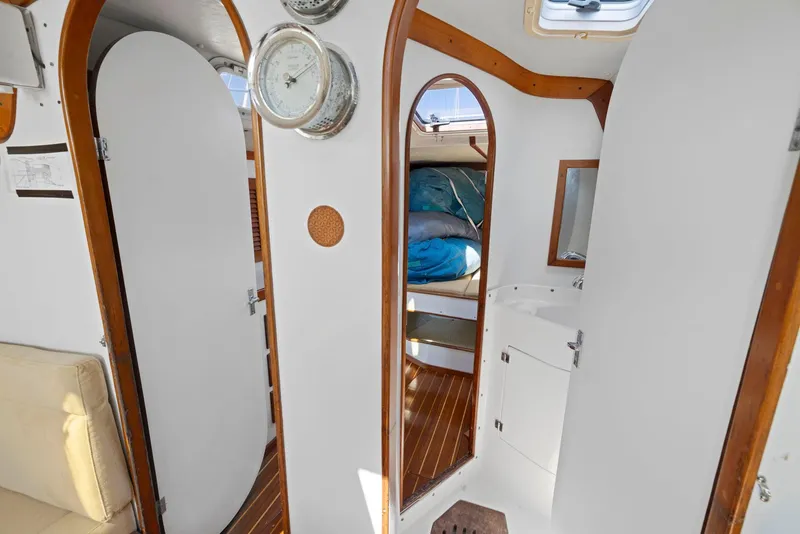 Slide: The Image of Interior of 1994 J Boats J/130 sailboat with wood accents and nautical decor. - 31