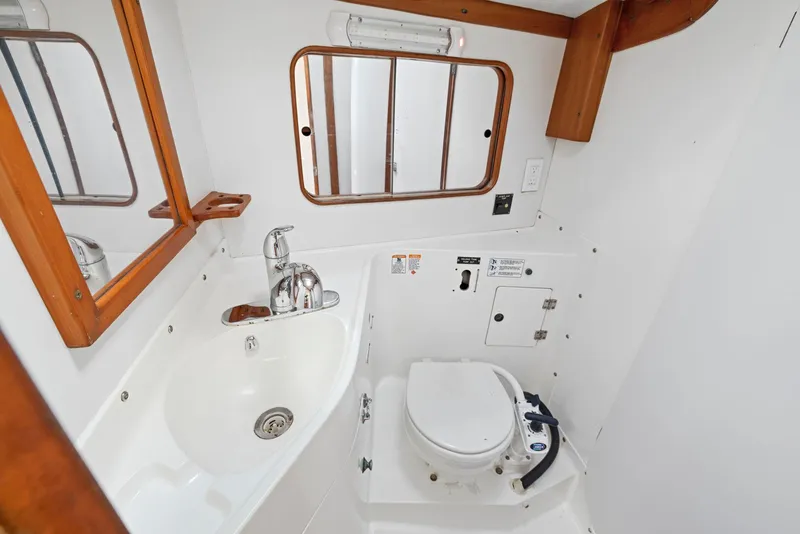 Slide: The Image of Bathroom interior of 1994 J Boats J/130 yacht with sink and toilet. - 34