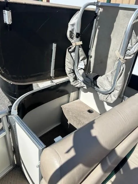 Slide: The Image of 2010 Sun Tracker PARTY BARGE 22 Regency Edition interior with seating and storage. - 28